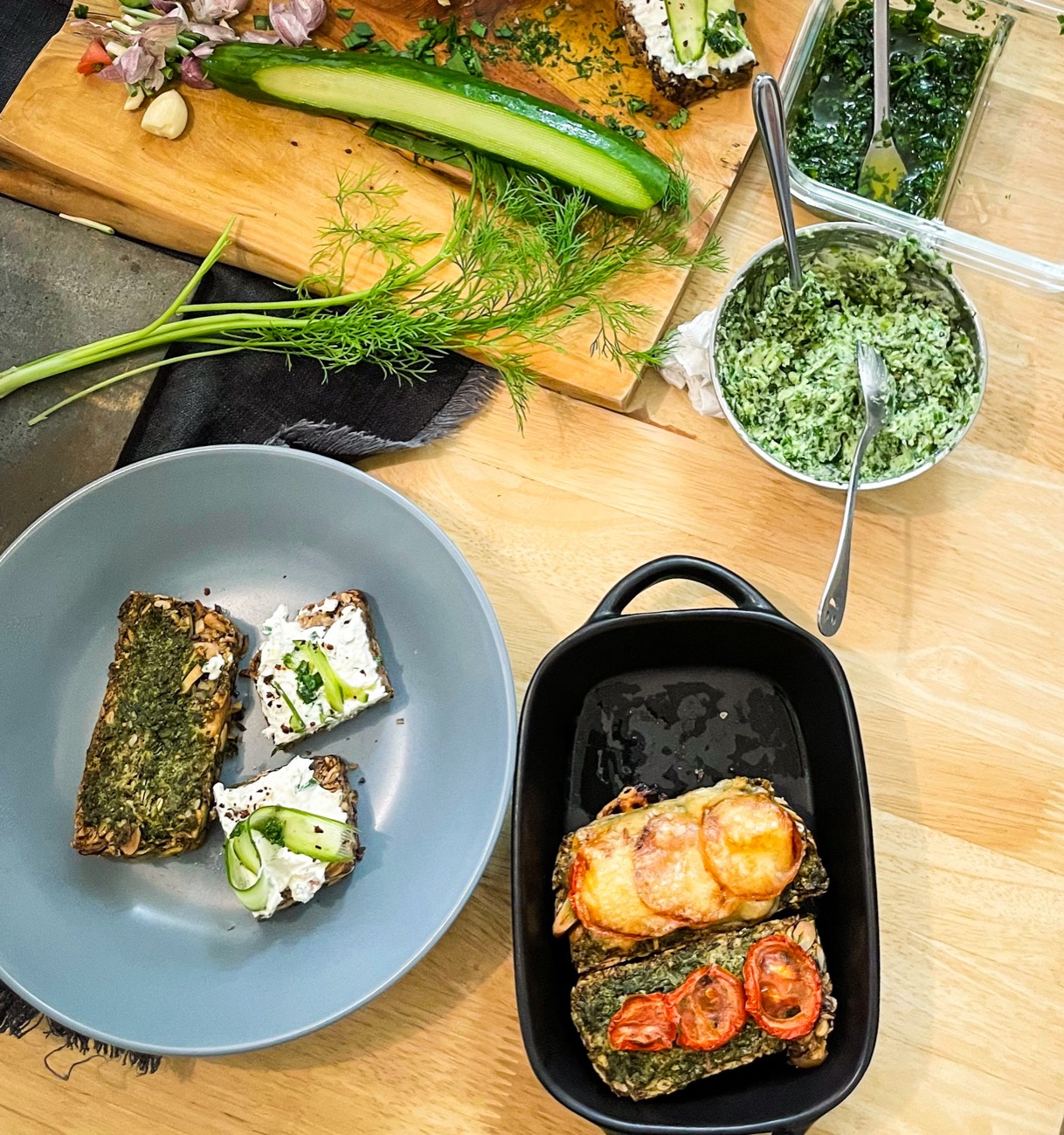 People gathered around a shared table with food and art